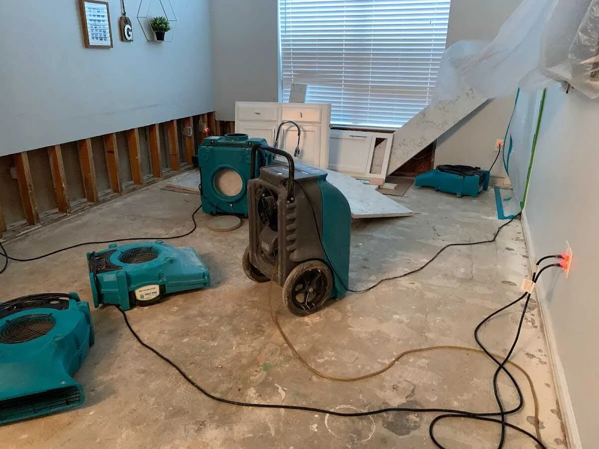 Dehumidifier in flood-cut room for Water Damage Restoration in Rapho